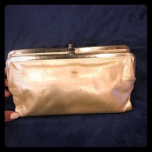 Pearl colored leather clutch